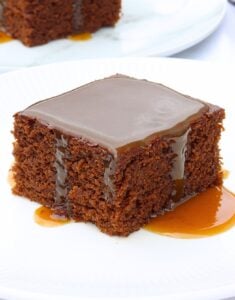 slice of molasses cake with molasses caramel sauce