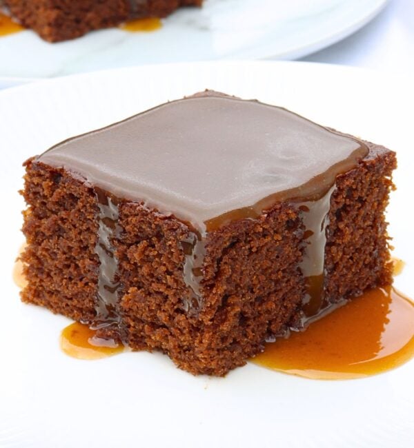 slice of molasses cake with molasses caramel sauce