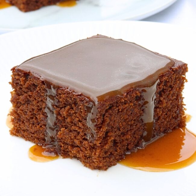 slice of molasses cake with molasses caramel sauce